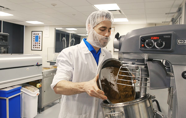 food scientist working with chocolate in lab